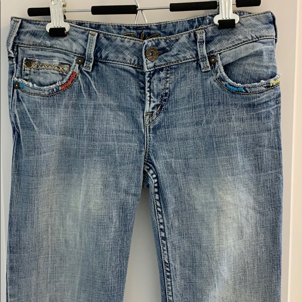 NWOT Silver Cleo jeans.